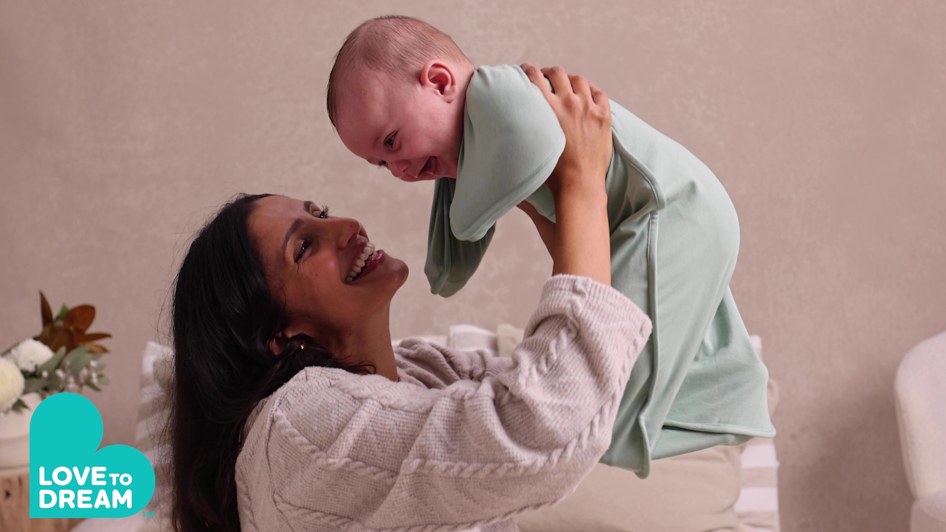 thumbnail video image 2 of Love to Dream Swaddle Up Baby Sleep Sack, Arms Up Design, Sleep Nearly 2x Longer, Twin Zipper, Cotton, Small 8-13 lbs, 1.0 TOG, Deep Olive, 2 of 13